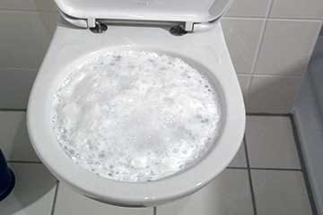 Overflowing toilets can be a symptom of a clogged sewer line.