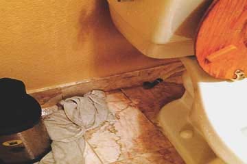 A simple toilet leak can flood your bathroom floor, getting under tiles and soaking drywall.